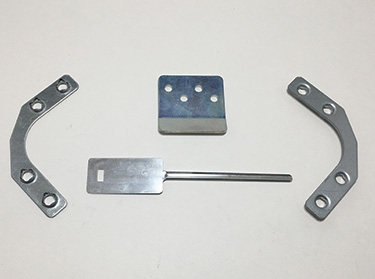 Flat metal stampings and formed parts produced by Four-Slide Technology, Inc.