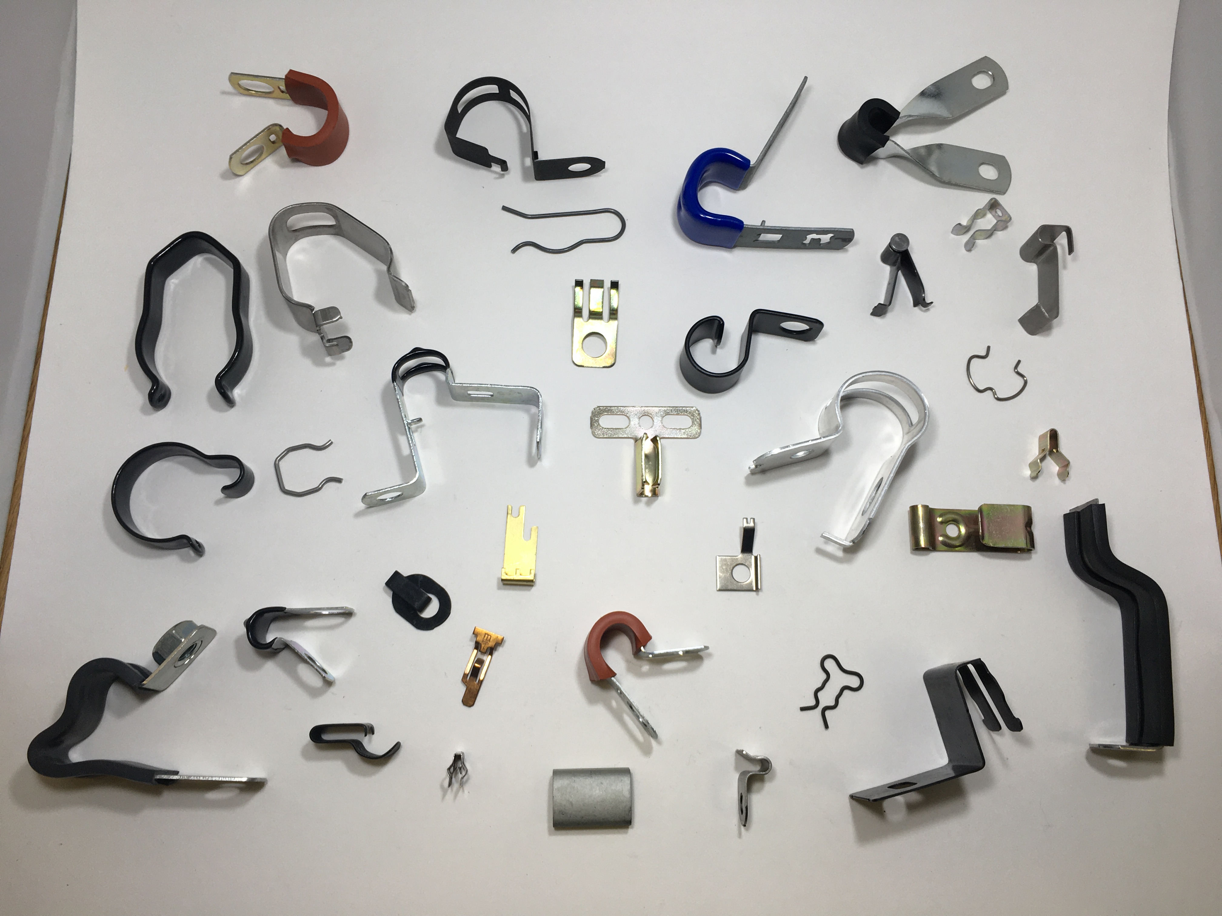 Assorted metal fasteners and custom components produced by Four-Slide Technology, Inc.